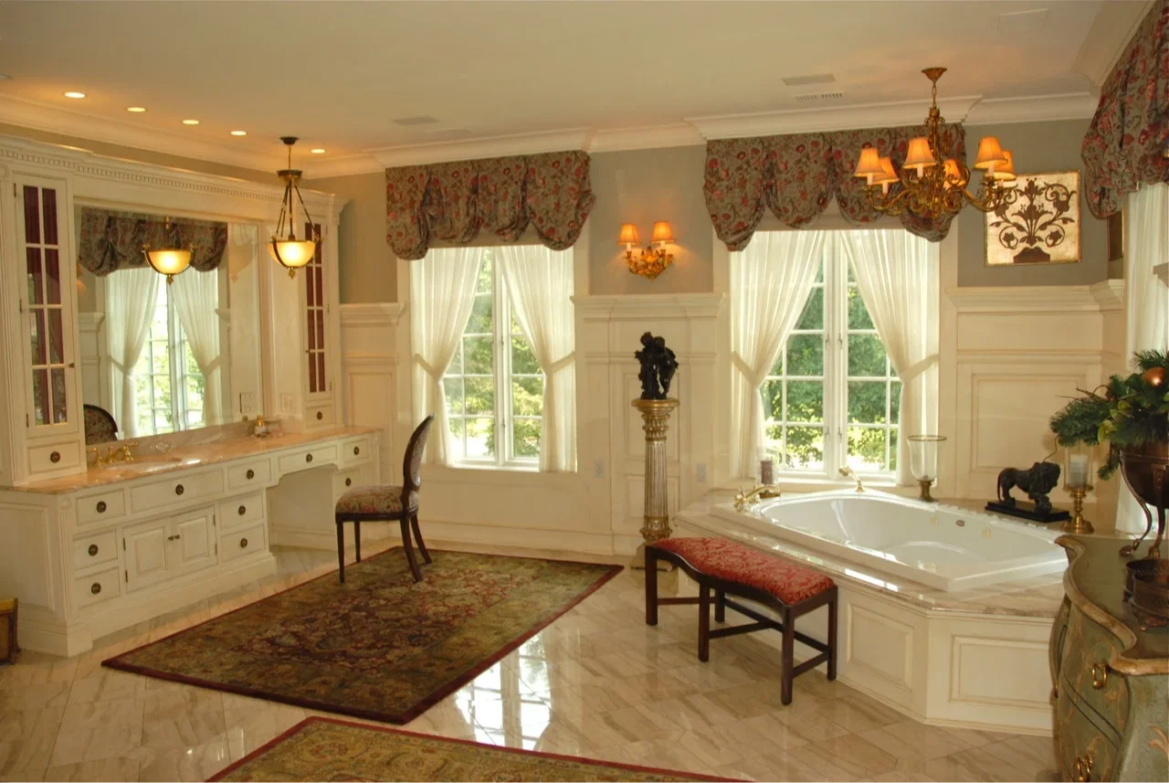 Creative architectural team workspace exemplifying one of a kind home design process for large custom homes at Myron Haydt Homes with blueprint discussions, scale models, and a dynamic modern studio environment.